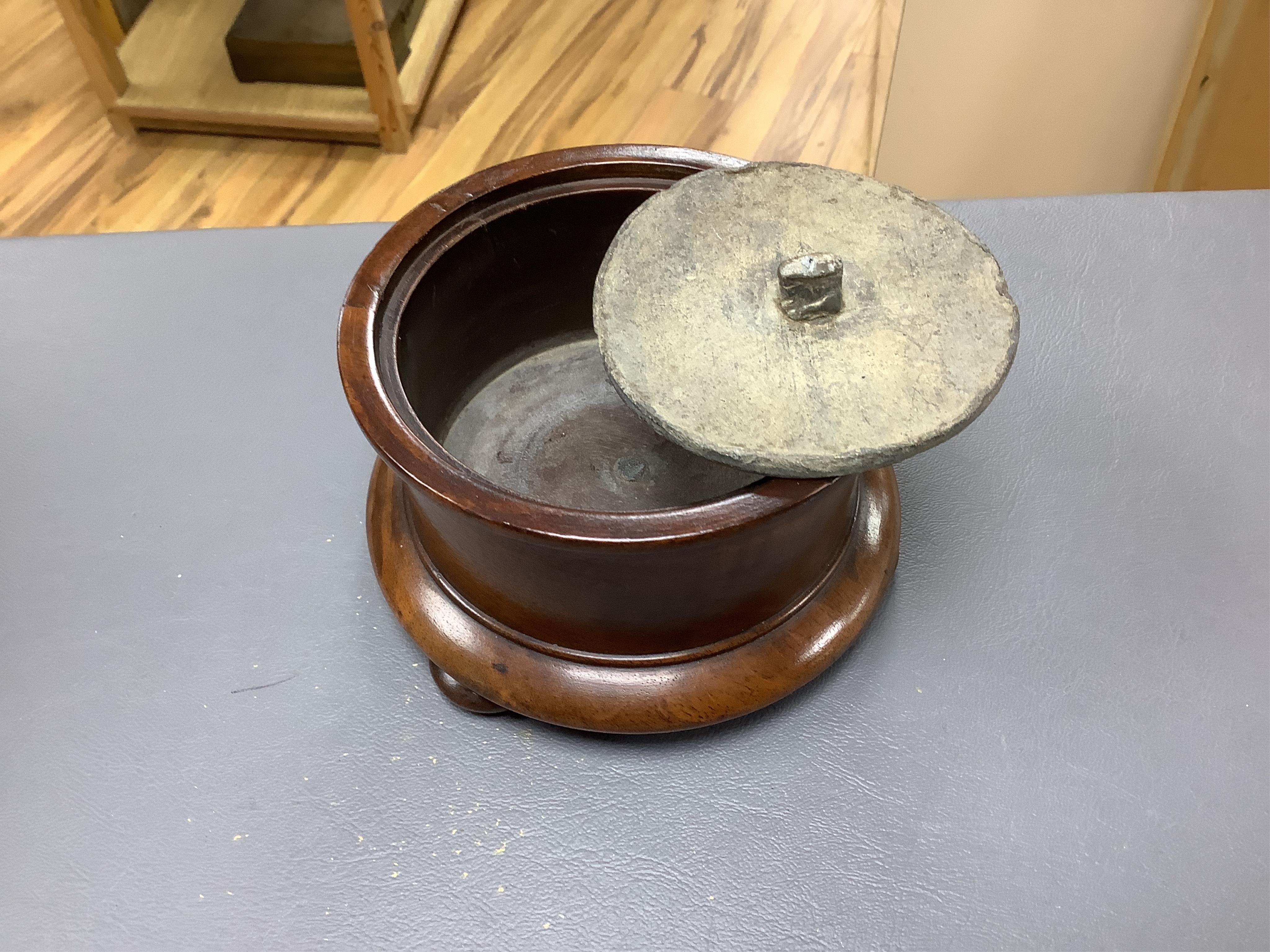 An 18th/19th century lignum vitae wassail bowl and a circular mahogany tobacco box, largest 18cm high